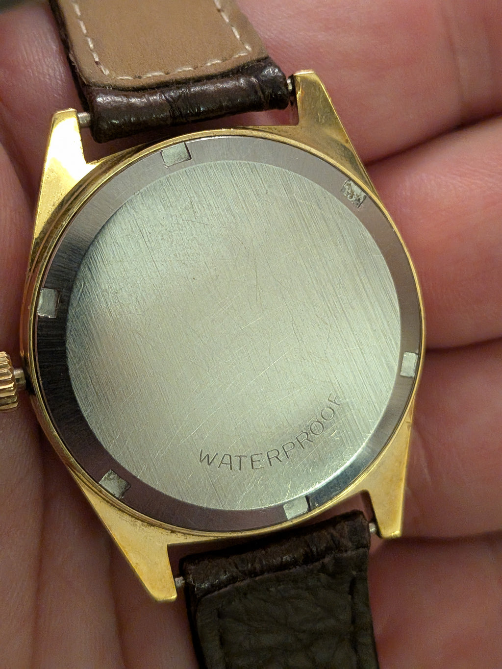 Omega Geneve gold with brown strap