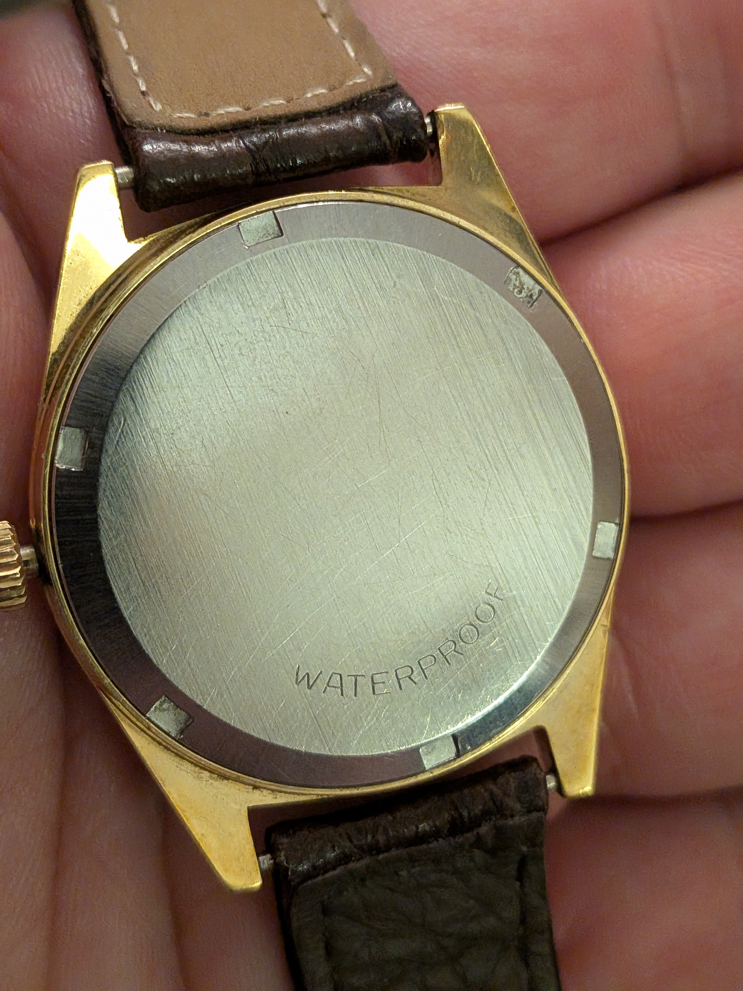 Omega Geneve gold with brown strap