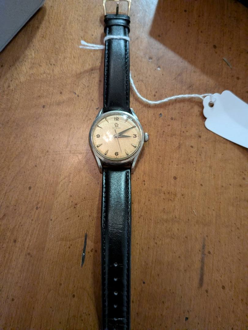Omega - silver, black strap, arrow head dial