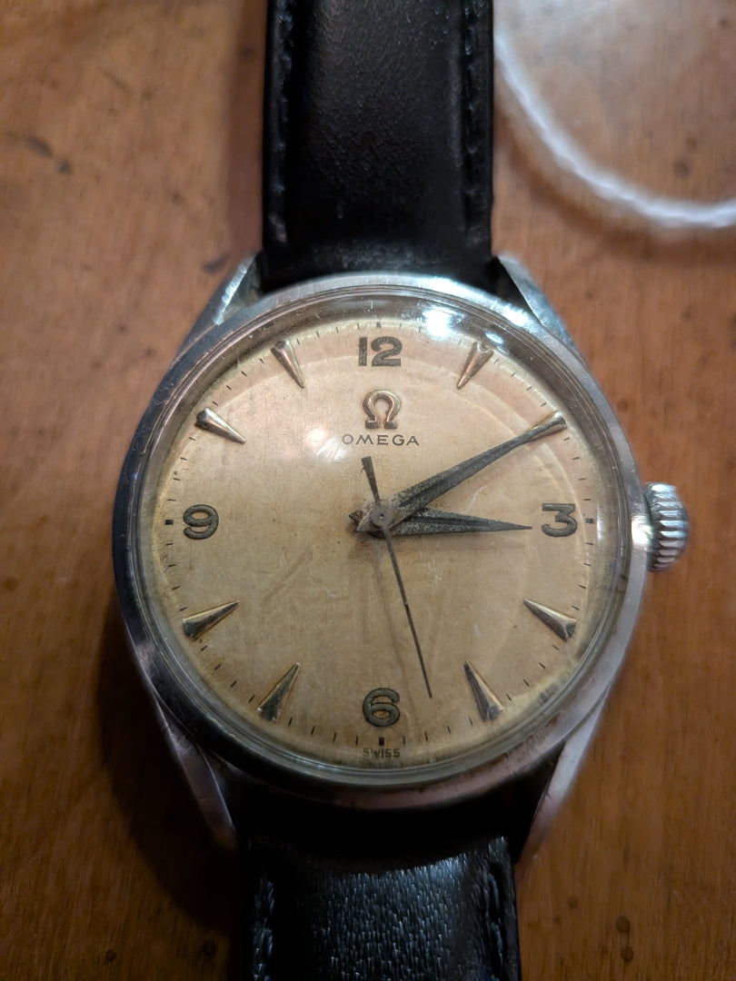 Omega - silver, black strap, arrow head dial