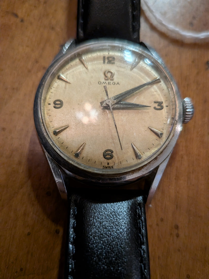Omega - silver, black strap, arrow head dial