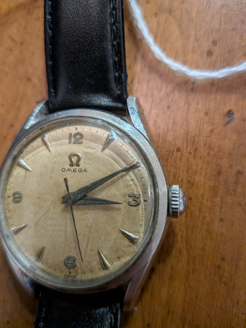 Omega - silver, black strap, arrow head dial
