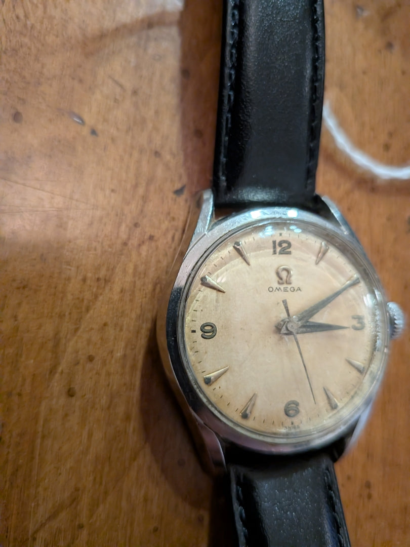 Omega - silver, black strap, arrow head dial
