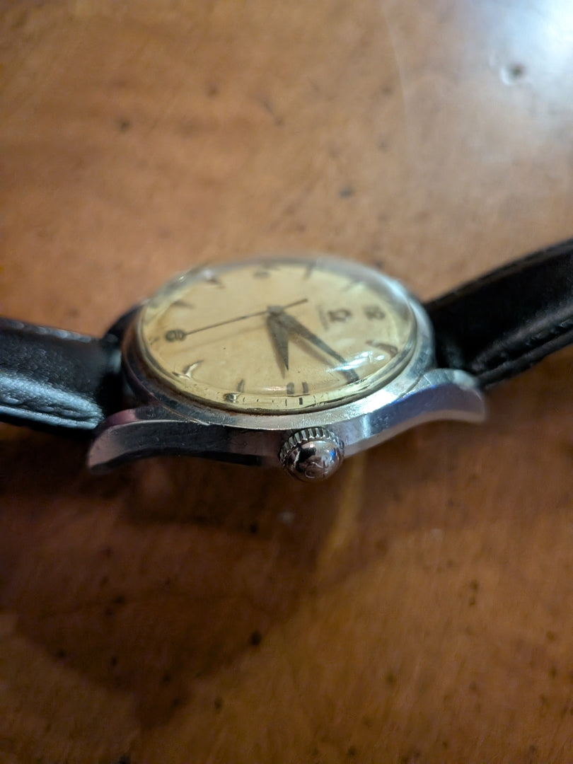 Omega - silver, black strap, arrow head dial