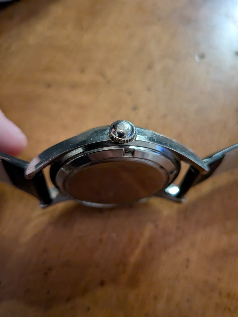 Omega - silver, black strap, arrow head dial
