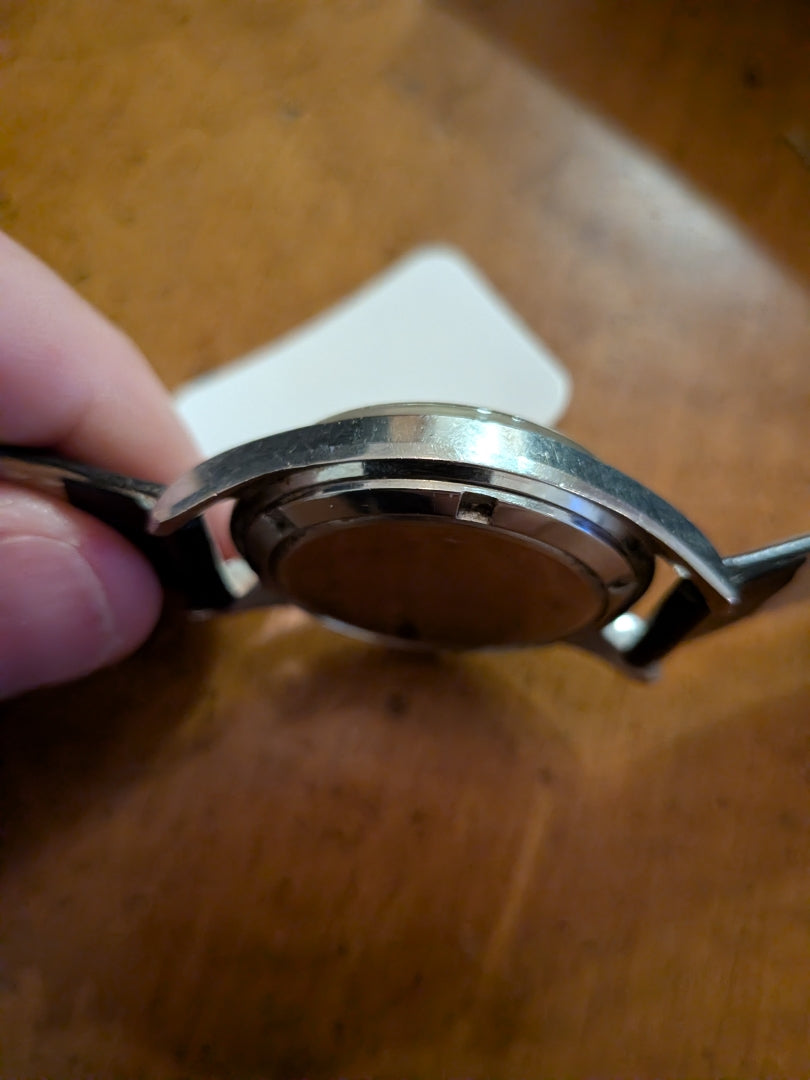 Omega - silver, black strap, arrow head dial